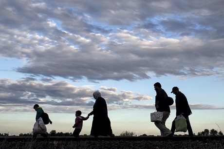migrants walk along rail tracks roszke hungary 2015