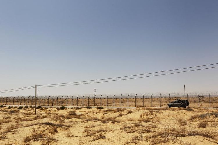 611285-an-israeli-military-vehicle-drives-along-israel-s-border-with-egypt-s-sinai-desert-near-the-nitzana-